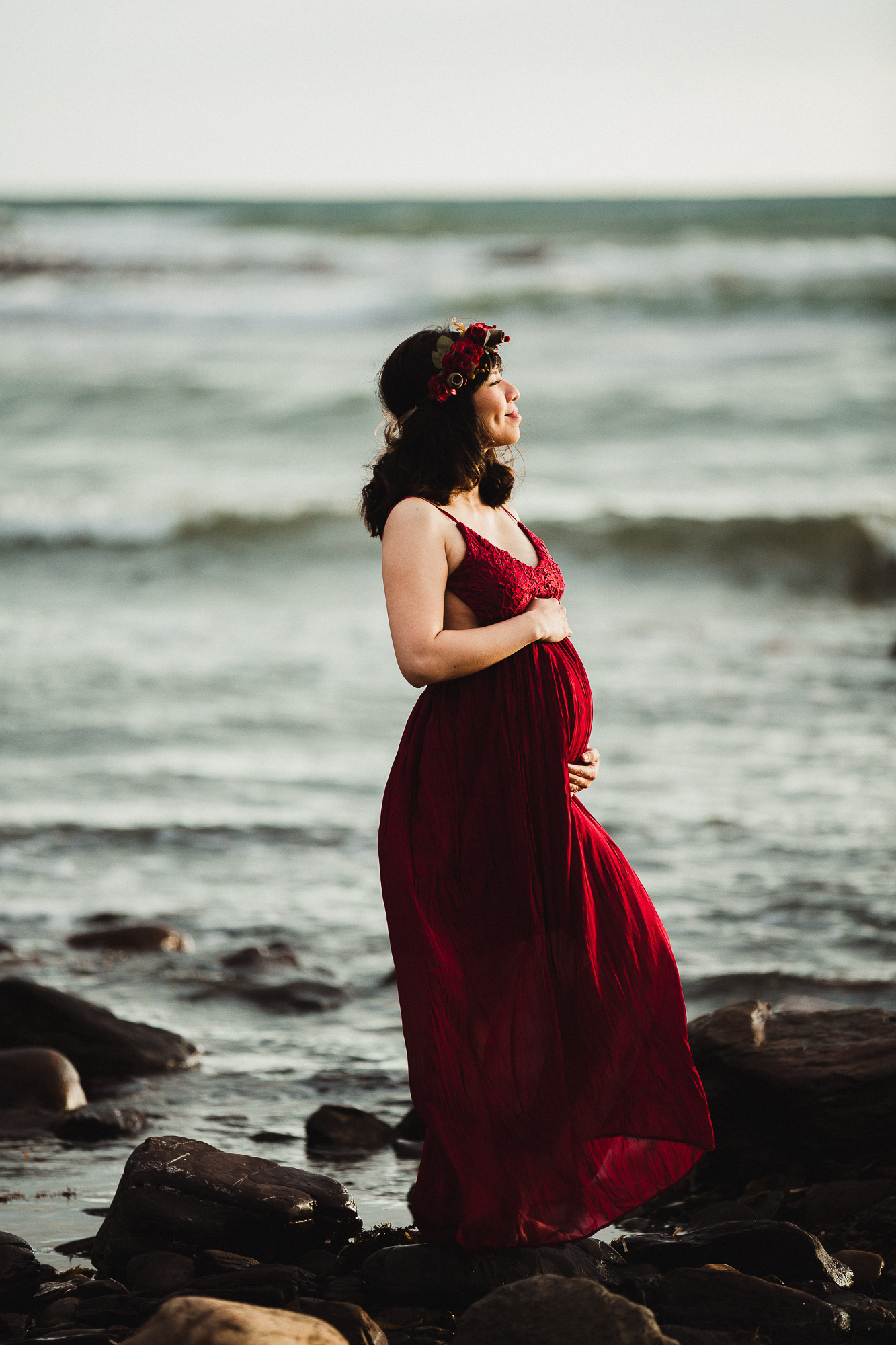 Adelaide maternity photograph of a pregnant mother in a red dress.