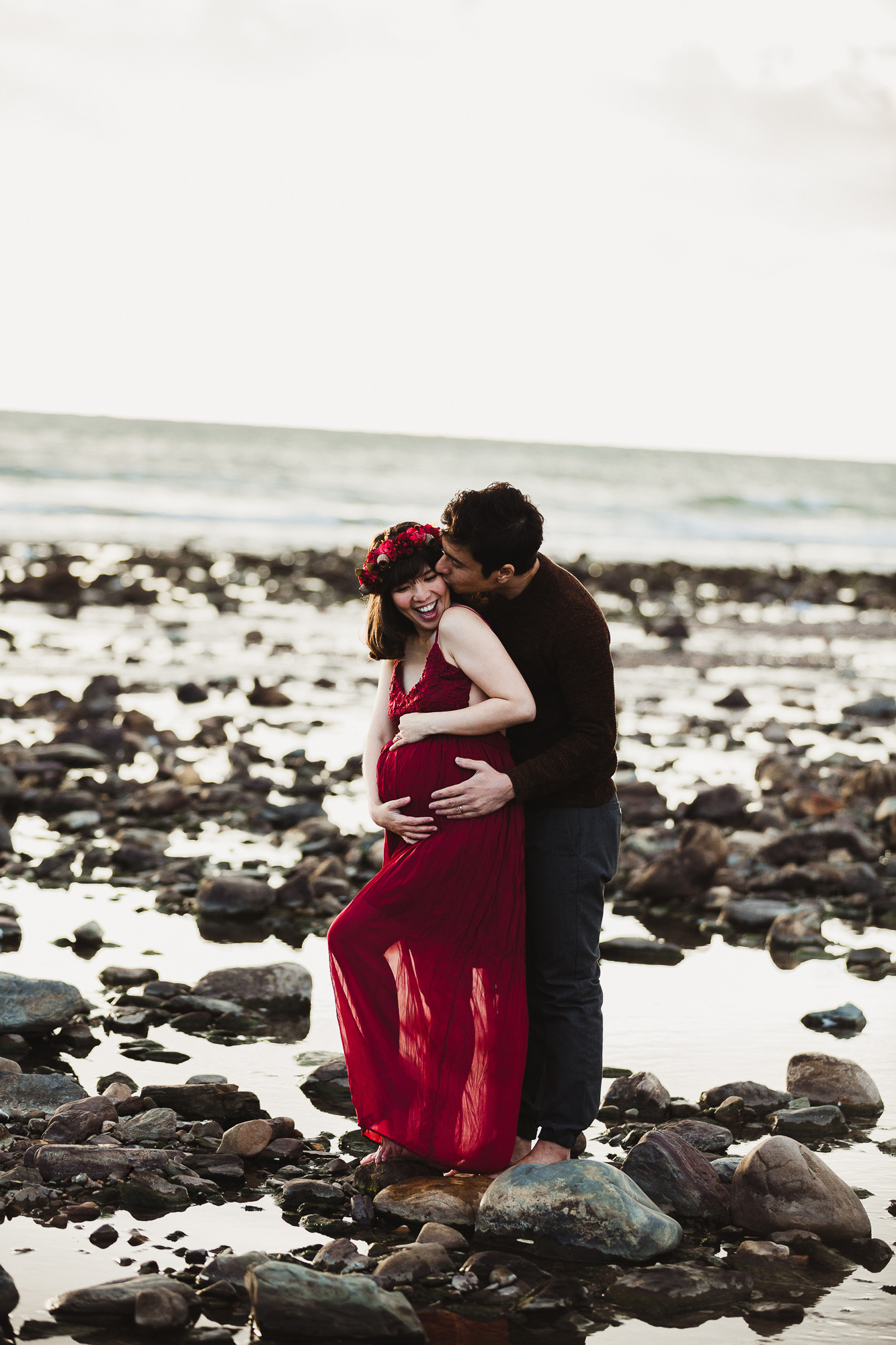 Adelaide maternity photograph of a pregnant mother in a red dress.