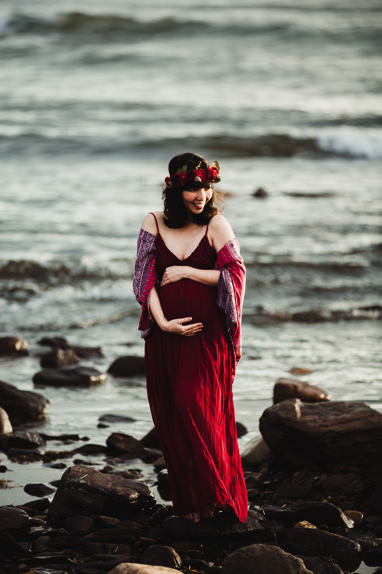 Adelaide maternity photograph of a pregnant mother in a red dress.