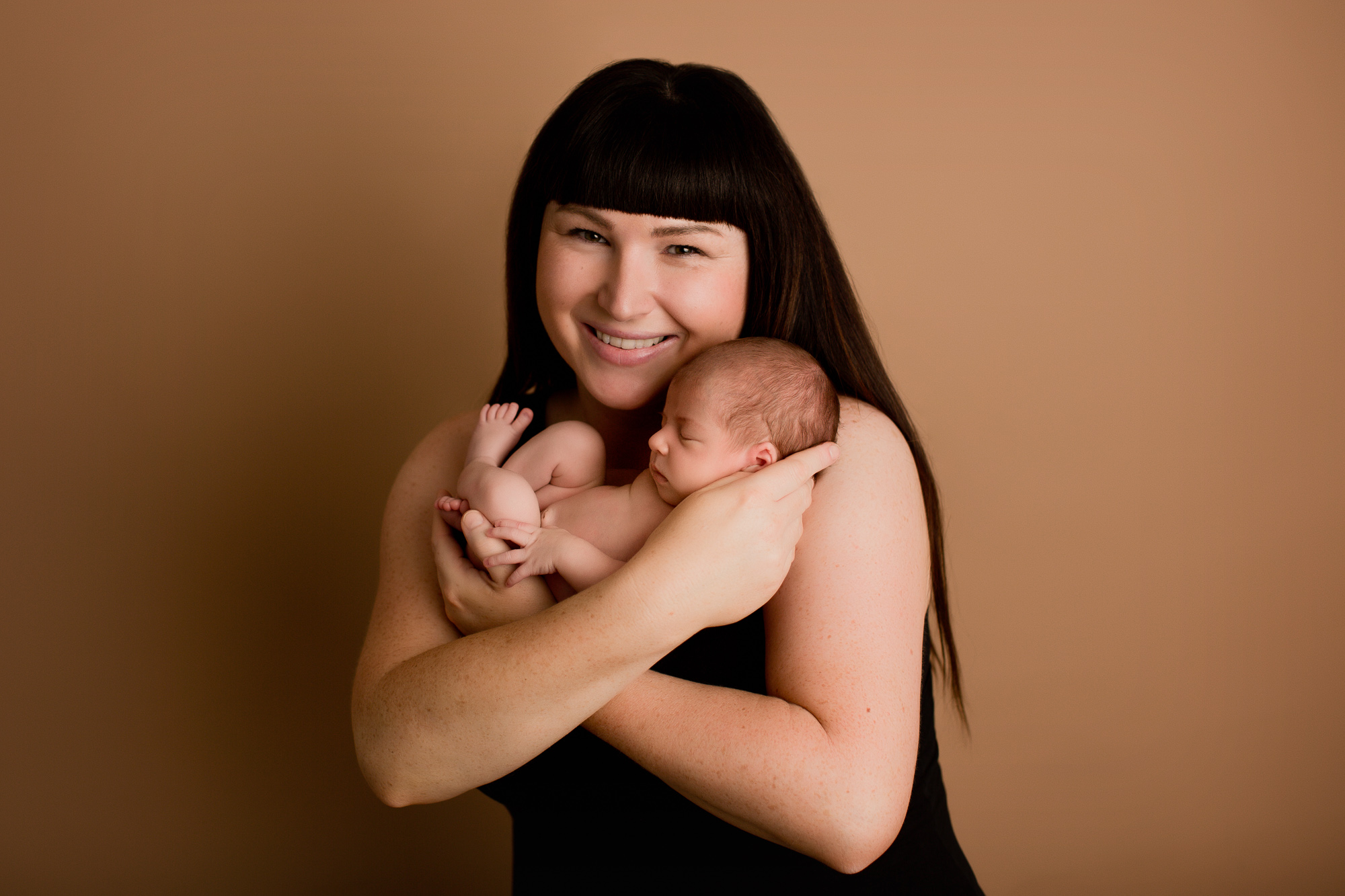 Adelaide newborn baby photographer's photo of a newborn baby with their family.