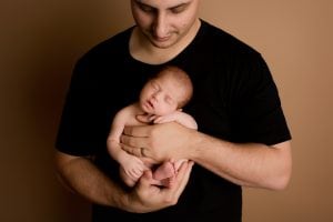 Adelaide newborn baby photographer's photo of a newborn baby with their family.