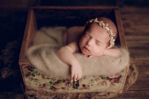 Adelaide newborn baby photographer's photo of a newborn baby in a drawer.