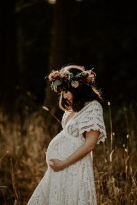 Adelaide maternity photographer's photo of a pregnant woman in a white dress.