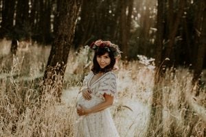 Adelaide maternity photographer's photo of a pregnant woman in a white dress.