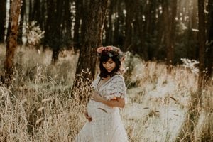Adelaide maternity photographer's photo of a pregnant woman in a white dress.