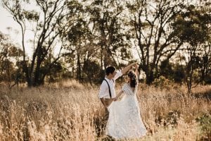 Adelaide maternity photograph of a pregnant woman in a white lace dress.