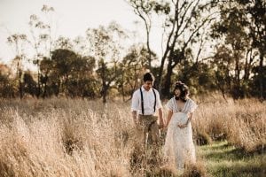 Adelaide maternity photograph of a pregnant woman in a white lace dress.
