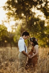 Adelaide maternity photograph of a pregnant mother in a rust coloured dress.
