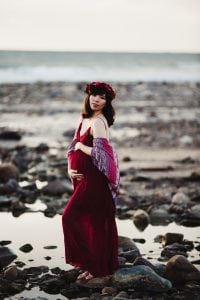 Adelaide maternity photograph of a pregnant mother in a red dress.