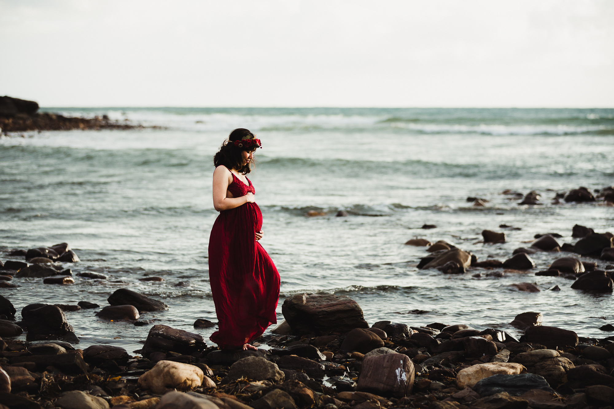 Adelaide maternity photograph of a pregnant mother in a red dress.