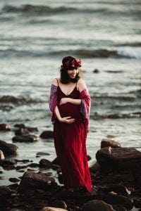 Adelaide maternity photograph of a pregnant mother in a red dress.