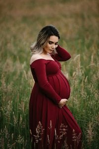 Adelaide maternity photographer's photo of a pregnant mother in a red dress.