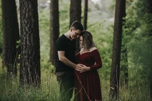 Adelaide maternity photographer's photo of a pregnant mother in a red dress.