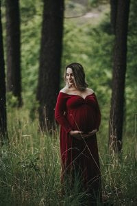 Adelaide maternity photographer's photo of a pregnant mother in a red dress.