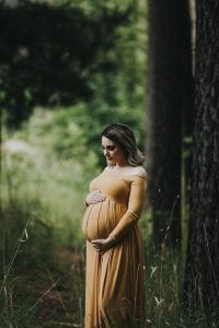Adelaide maternity photographer's photo of a pregnant mother in a mustard dress.