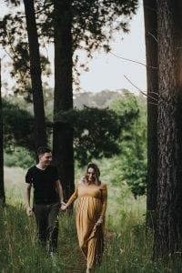 Adelaide maternity photographer's photo of a pregnant mother in a mustard dress.